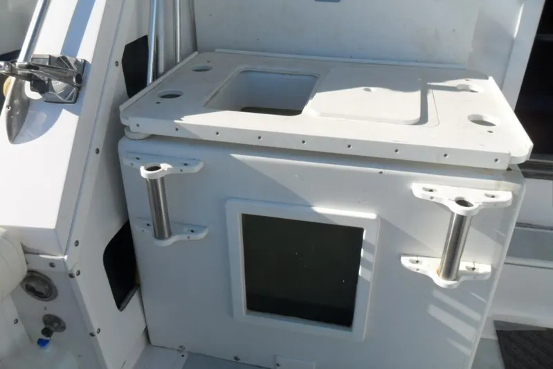  Yacht Photos Pics 1979 Bertram 46.6 Sport Fisher boat interior with fishing rod holders and storage compartment.