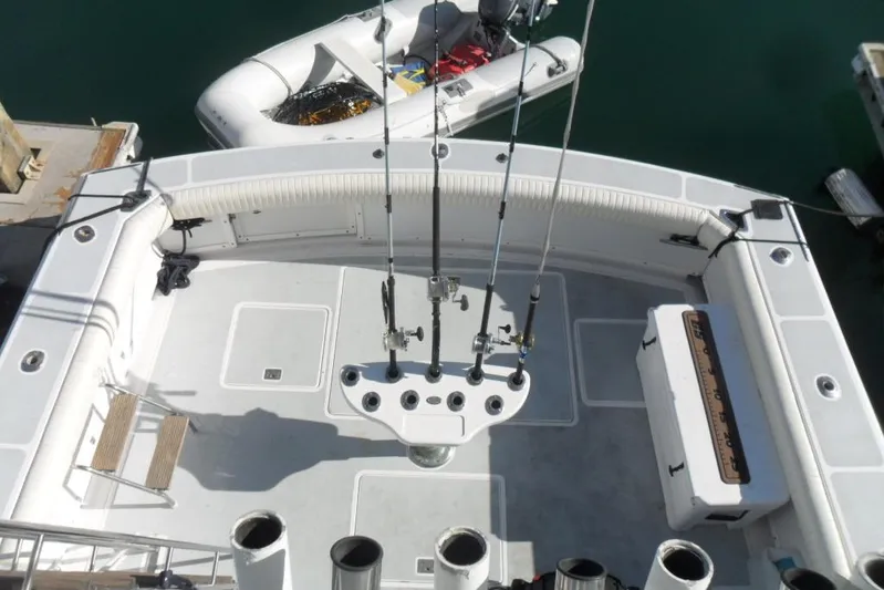  Yacht Photos Pics 1979 Bertram 46.6 Sport Fisher boat deck with fishing rods and equipment.