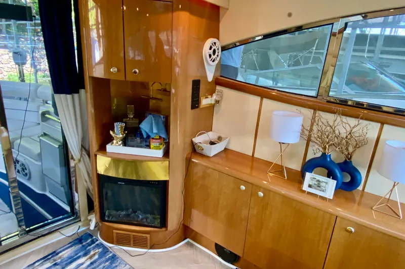  Yacht Photos Pics Luxurious interior of 1999 Neptunus 54 Hardtop Express yacht with elegant wood cabinetry.