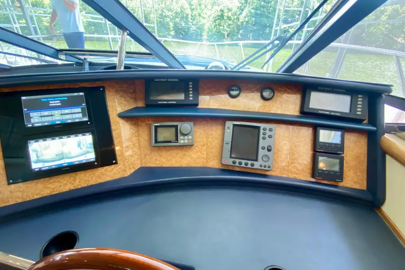  Yacht Photos Pics Control panel of 1999 Neptunus 54 Hardtop Express yacht with navigation instruments.
