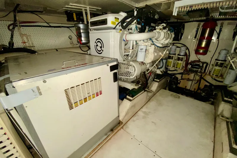  Yacht Photos Pics Engine room of 1999 Neptunus 54 Hardtop Express with visible machinery and equipment.