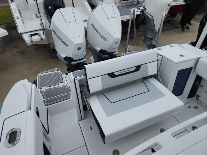  Yacht Photos Pics 2023 Blackfin 272 CC boat with dual Mercury engines and sleek seating area.