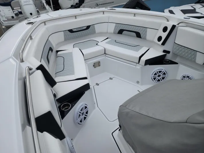  Yacht Photos Pics 2023 Blackfin 272 CC boat interior with cushioned seating and built-in speakers.