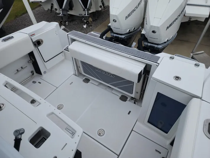  Yacht Photos Pics 2023 Blackfin 272 CC boat deck with Mercury engines, featuring spacious seating and storage.