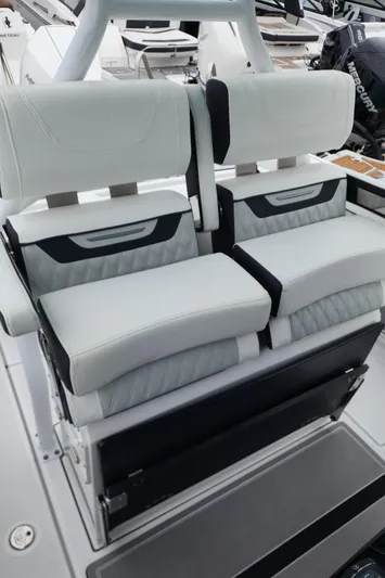  Yacht Photos Pics 2023 Blackfin 272 CC boat seating with modern white and black design.
