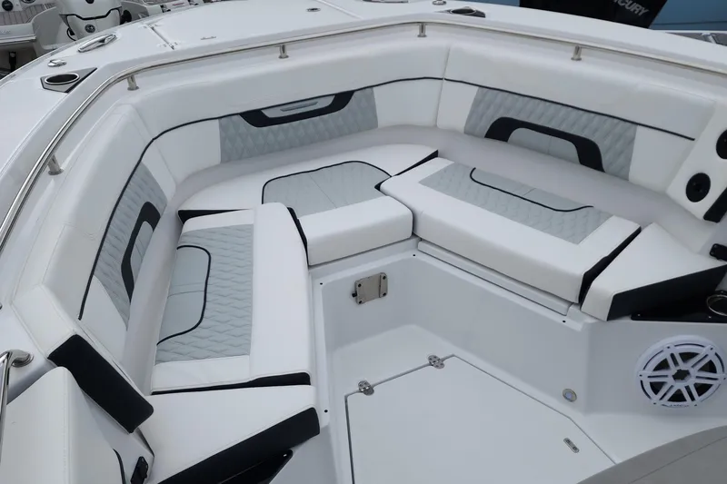  Yacht Photos Pics 2023 Blackfin 272 CC boat interior with cushioned seating and modern design.