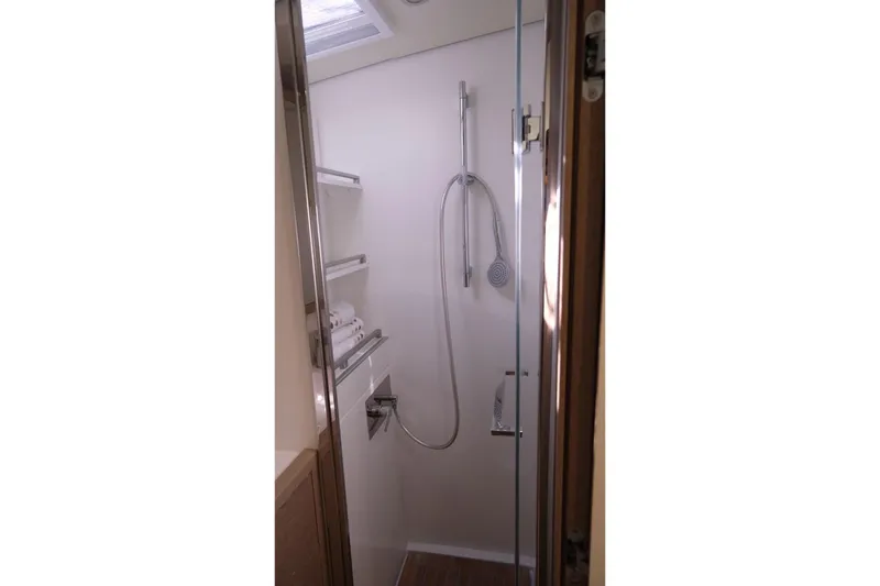  Yacht Photos Pics Shower area in 2020 Lagoon 630 MY yacht with modern fixtures and shelving.