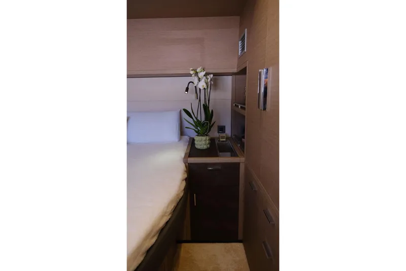  Yacht Photos Pics Luxurious interior of 2020 Lagoon 630 MY yacht with elegant decor and orchid plant.