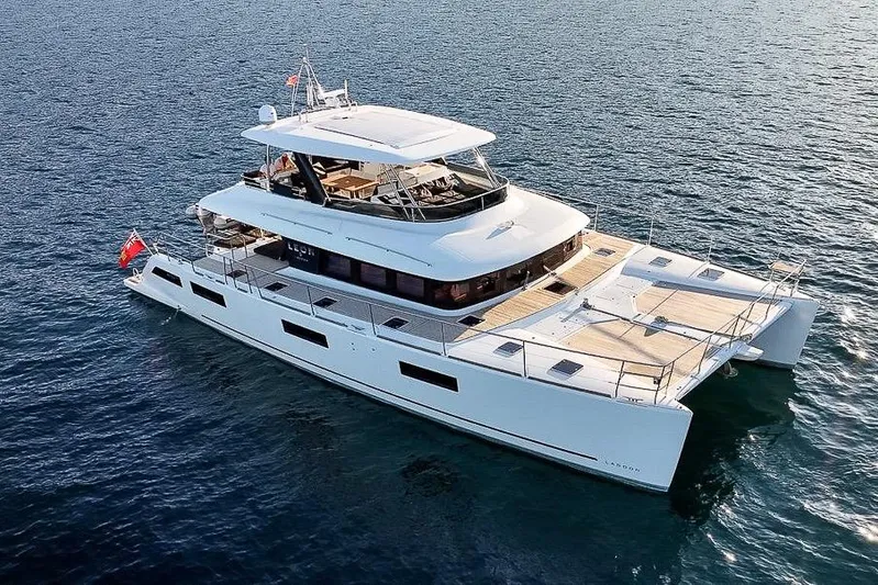  Yacht Photos Pics 2020 Lagoon 630 MY luxury yacht cruising on open water.