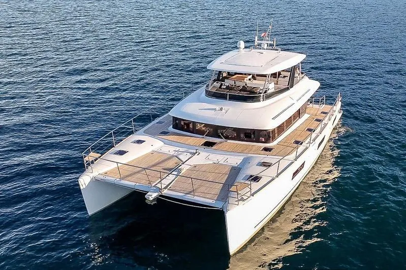  Yacht Photos Pics Luxurious 2020 Lagoon 630 MY yacht cruising on open water.