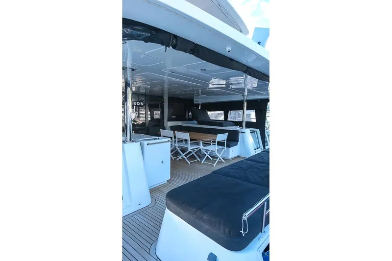 Yacht Photos Pics Spacious deck of 2020 Lagoon 630 MY yacht with seating and dining area.