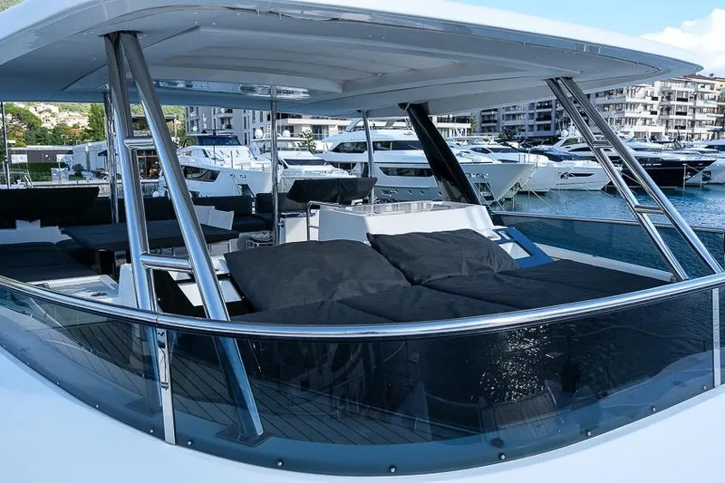  Yacht Photos Pics Luxurious 2020 Lagoon 630 MY yacht with spacious deck and modern design in marina.