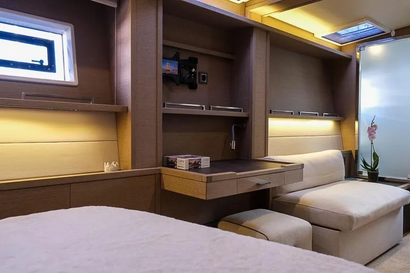  Yacht Photos Pics Luxurious interior of 2020 Lagoon 630 MY yacht with modern furnishings and ambient lighting.