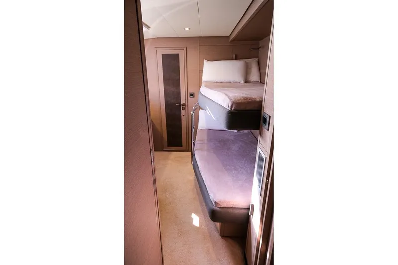  Yacht Photos Pics Interior of 2020 Lagoon 630 MY yacht with cozy bunk beds and modern design.