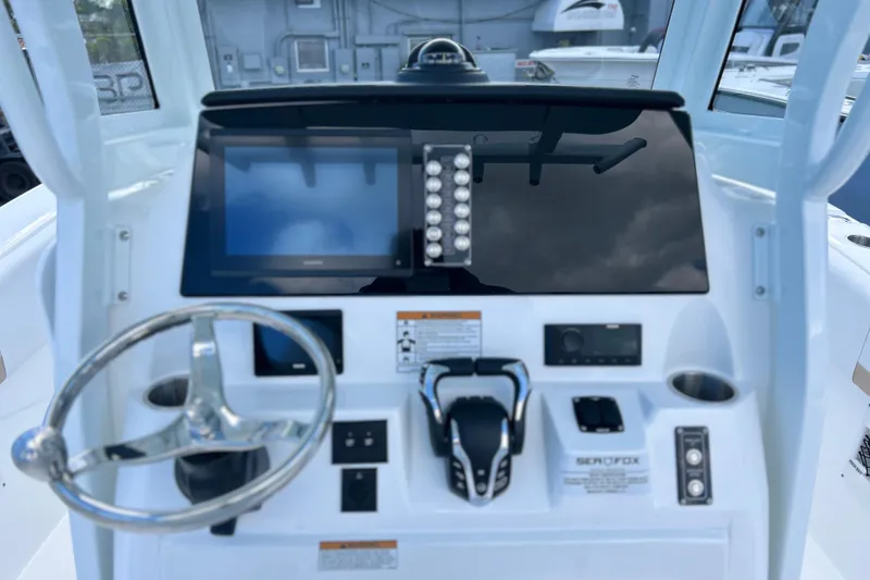 Yacht Photos Pics 2026 Sea Fox 268 Commander dashboard with steering wheel and modern controls.