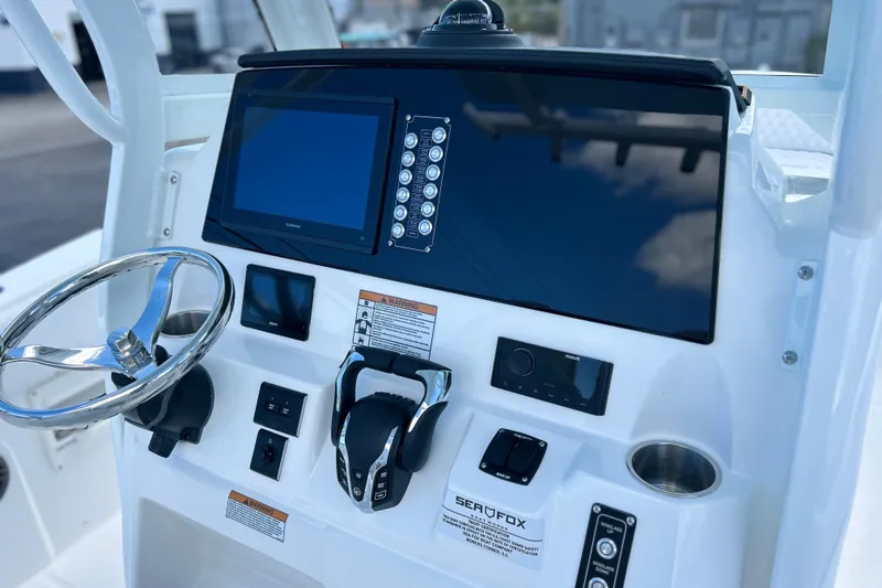  Yacht Photos Pics 2026 Sea Fox 268 Commander boat dashboard with steering wheel and control panel.