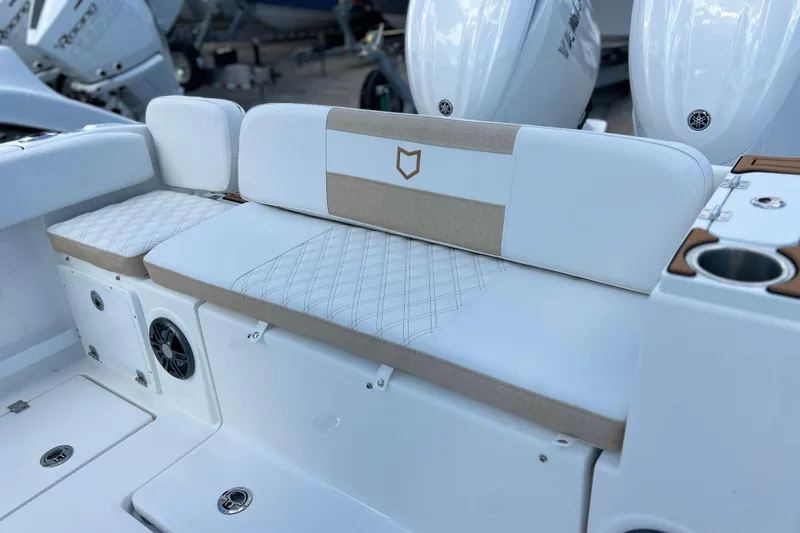  Yacht Photos Pics 2026 Sea Fox 268 Commander boat seating with white and beige upholstery.
