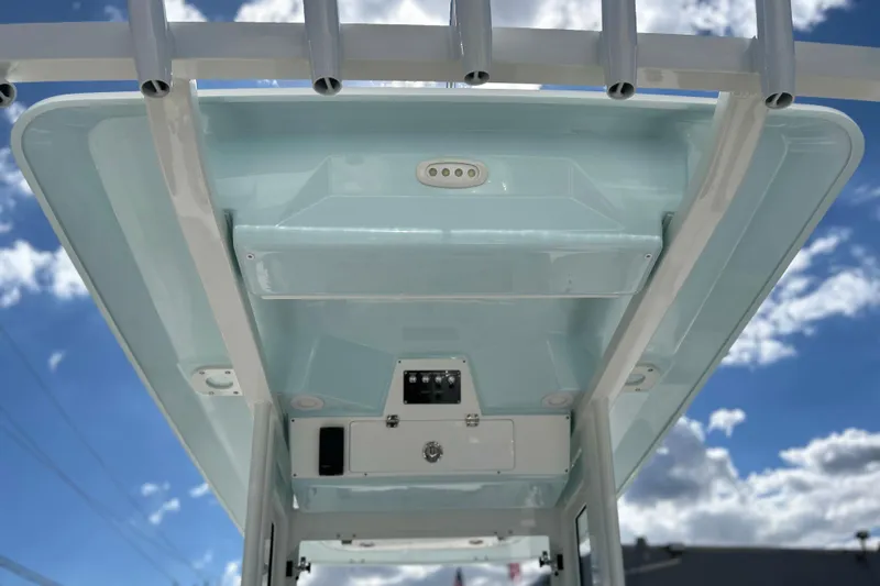  Yacht Photos Pics 2026 Sea Fox 268 Commander boat roof against a bright blue sky with clouds.