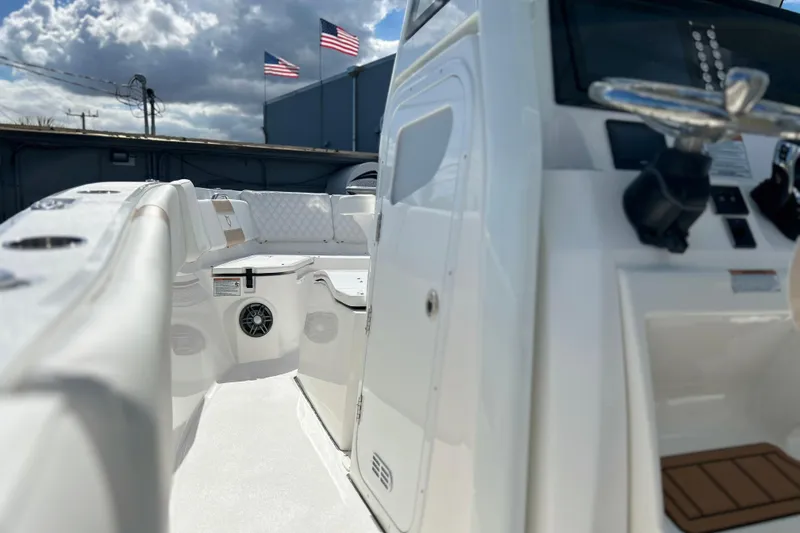  Yacht Photos Pics 2026 Sea Fox 268 Commander boat interior with steering wheel, seating, and American flags.