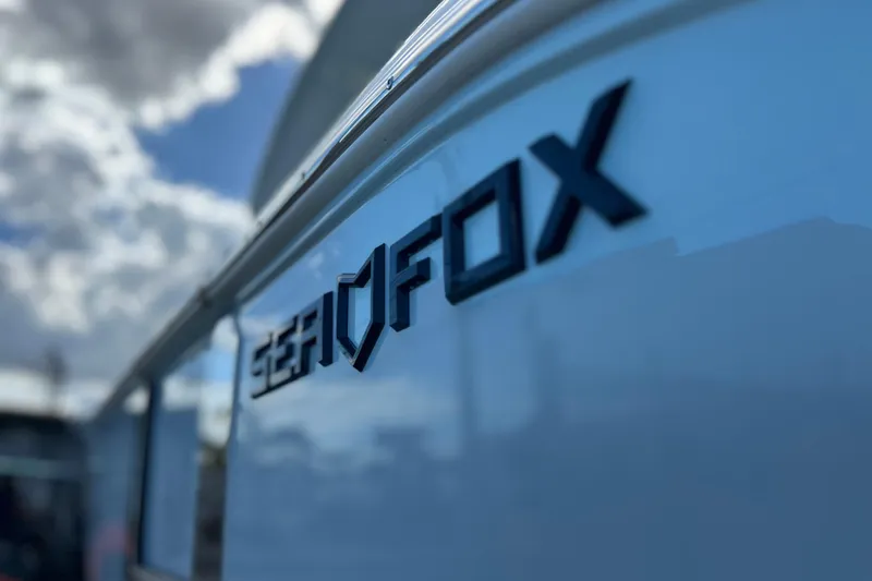  Yacht Photos Pics Close-up of 2026 Sea Fox 268 Commander logo on boat exterior.