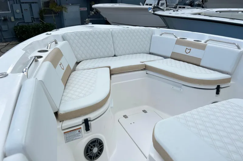  Yacht Photos Pics Luxurious seating area on 2026 Sea Fox 268 Commander boat, featuring quilted upholstery and cup holders.