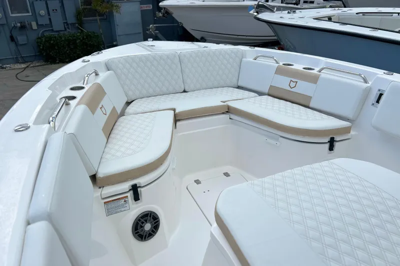  Yacht Photos Pics 2026 Sea Fox 268 Commander boat interior with cushioned seating and cup holders.