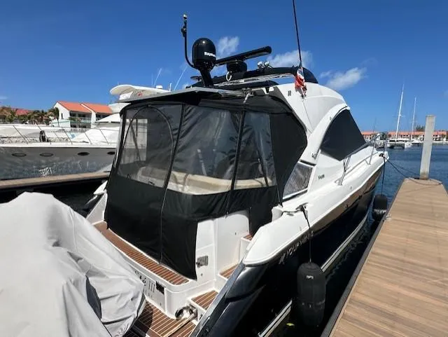 Namaste III Yacht Photos Pics 2010 Four Winns V435 yacht docked at marina under clear blue sky.