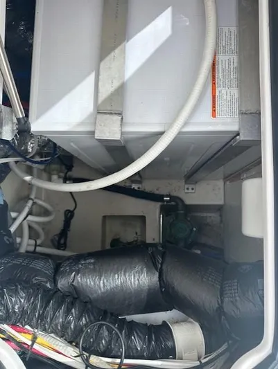 Namaste III Yacht Photos Pics 2010 Four Winns V435 engine compartment with hoses and wiring.