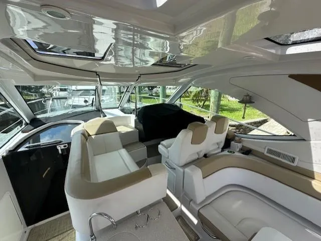 Namaste III Yacht Photos Pics Luxurious interior of 2010 Four Winns V435 yacht with plush seating and modern design.