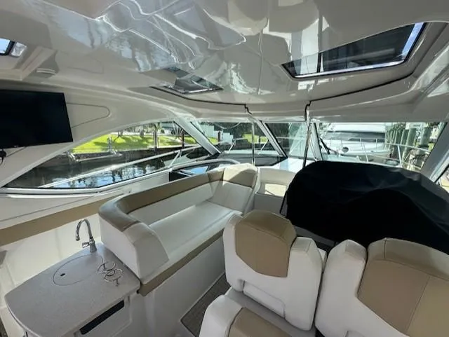Namaste III Yacht Photos Pics Luxurious interior of 2010 Four Winns V435 yacht with plush seating and modern amenities.