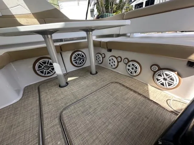 Namaste III Yacht Photos Pics 2010 Four Winns V435 boat interior with speakers and seating area.