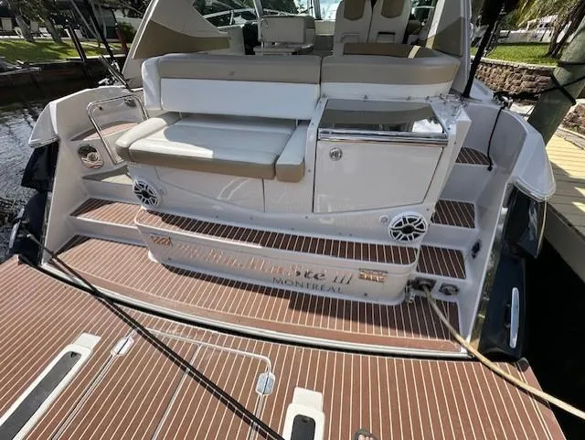 Namaste III Yacht Photos Pics 2010 Four Winns V435 boat with spacious deck and seating area.