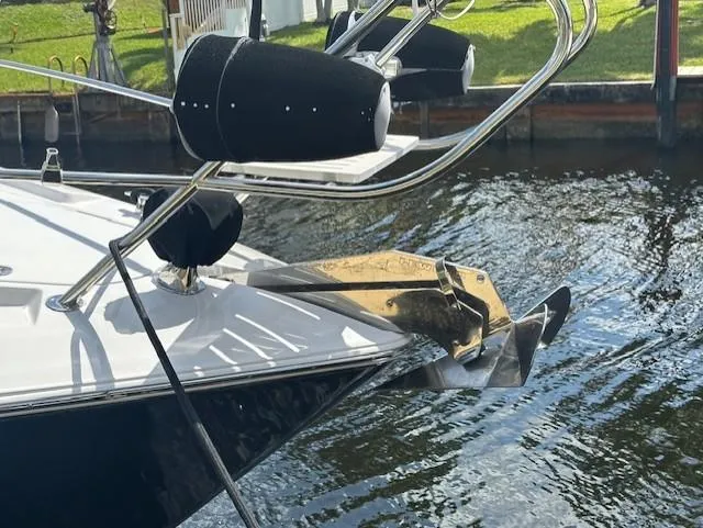 Namaste III Yacht Photos Pics 2010 Four Winns V435 boat anchor and bow detail by the water.