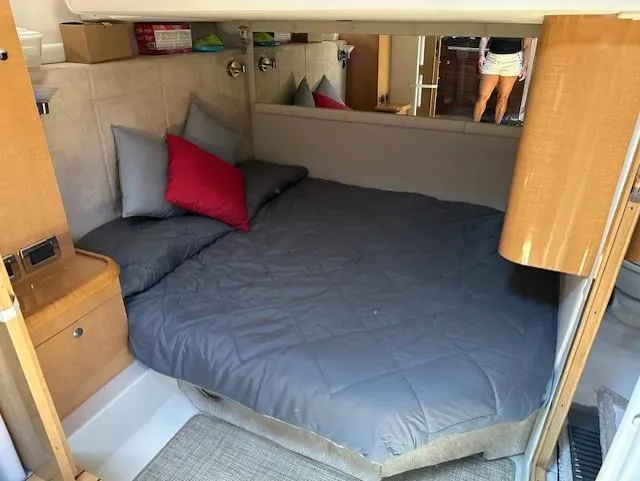 Namaste III Yacht Photos Pics Cozy cabin interior of 2010 Four Winns V435 yacht with bed and pillows.