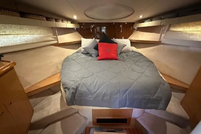 Namaste III Yacht Photos Pics Luxurious cabin interior of 2010 Four Winns V435 yacht with cozy bedding.