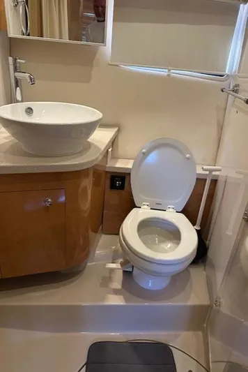 Namaste III Yacht Photos Pics 2010 Four Winns V435 yacht bathroom with modern sink and toilet.