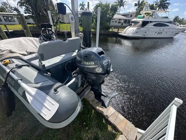 Namaste III Yacht Photos Pics Inflatable boat with Yamaha motor docked near a Four Winns V435 yacht, 2010 model.