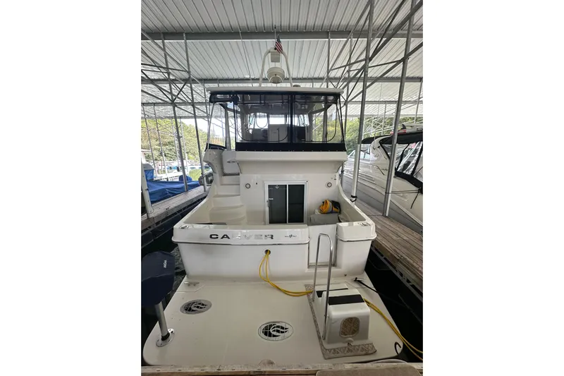  Yacht Photos Pics 2005 Carver 41 Cockpit Motor Yacht docked in a covered marina.