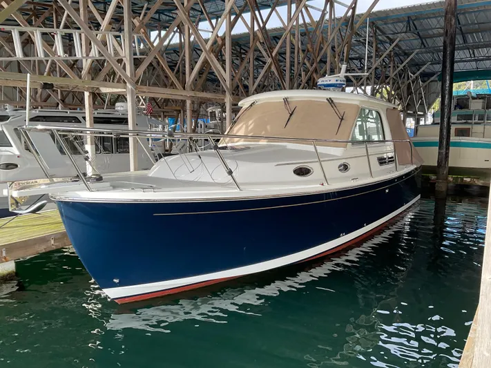  Yacht Photos Pics 2016 Back Cove 30 boat docked in a marina, featuring a sleek blue hull.