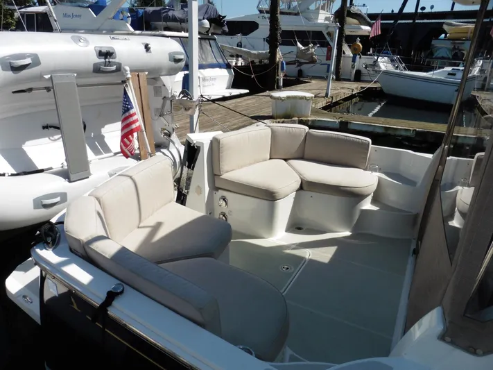  Yacht Photos Pics 2016 Back Cove 30 boat with beige seating, docked at a marina.