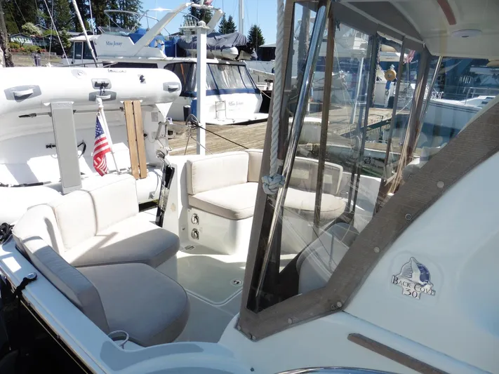  Yacht Photos Pics 2016 Back Cove 30 boat interior with seating, docked at marina.
