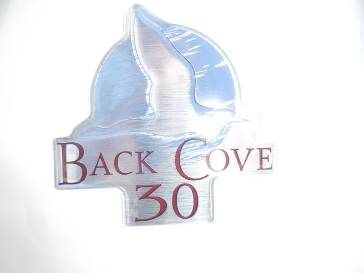  Yacht Photos Pics Back Cove 30 logo emblem, 2016 model, featuring a stylized wave and sail design.