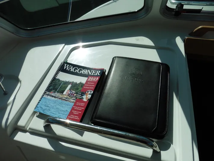  Yacht Photos Pics 2023 Waggoner guide and folder on Back Cove 30 yacht dashboard, 2016 model.