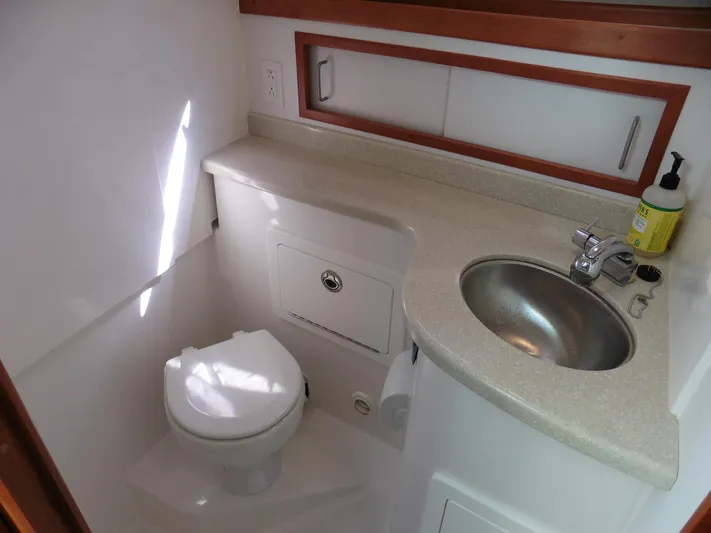  Yacht Photos Pics 2016 Back Cove 30 boat bathroom with sink, toilet, and countertop.