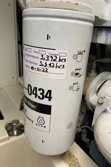 El Patron Yacht Photos Pics Oil filter with service details on a 2005 Cabo 40 Hardtop Express boat.