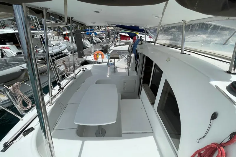 Carnabie Yacht Photos Pics 2014 Lagoon 380 S2 catamaran interior with seating area and marina view.