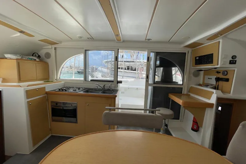 Carnabie Yacht Photos Pics Interior of 2014 Lagoon 380 S2 catamaran with kitchen and dining area.