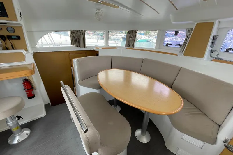 Carnabie Yacht Photos Pics Interior of 2014 Lagoon 380 S2 catamaran with dining area and seating.
