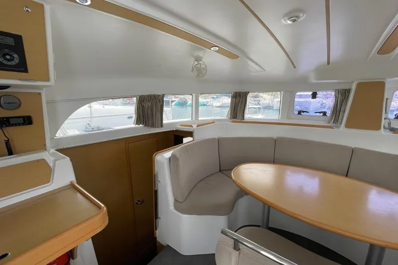 Carnabie Yacht Photos Pics Interior of 2014 Lagoon 380 S2 catamaran with cozy seating and dining area.