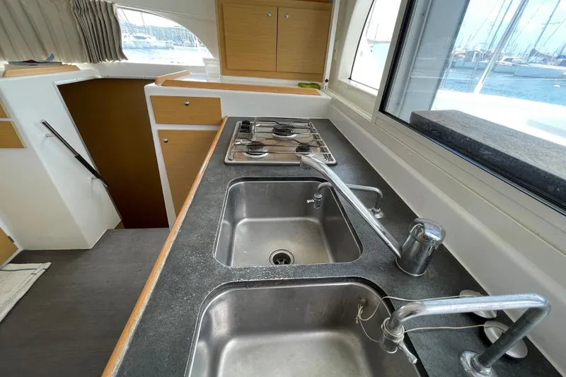 Carnabie Yacht Photos Pics Modern kitchen in 2014 Lagoon 380 S2 yacht with dual sinks and stove.